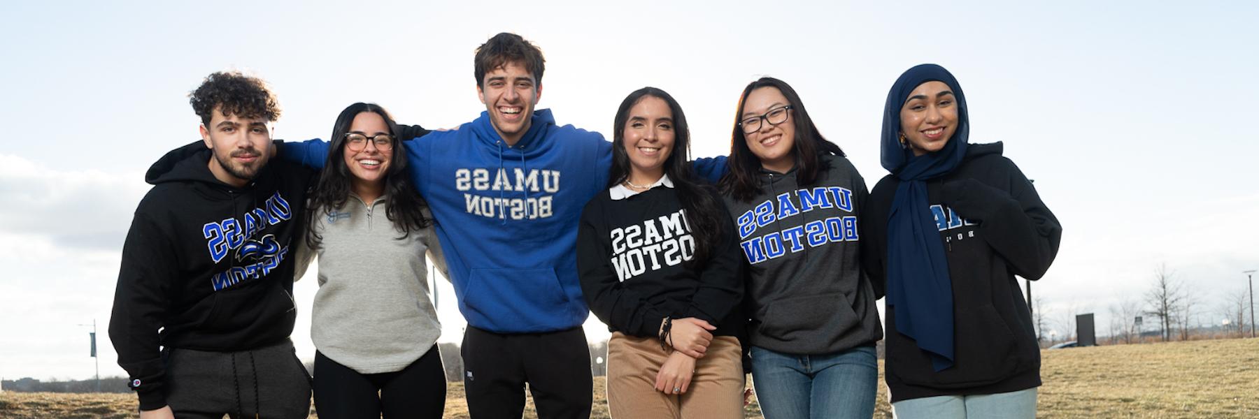 UMass Boston students wearing college gear